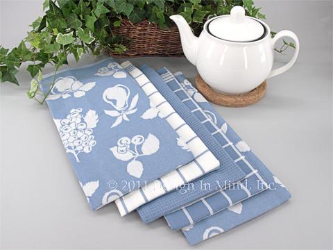 Assorted styles and patterns of kitchen linens.