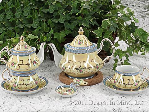 Personal sized porcelain tea sets in a very traditional Victorian style.